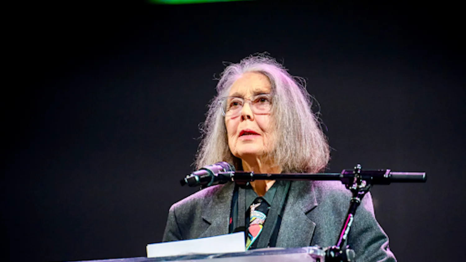 Anne Carson reading in the New York University Skirball Center at the 2024 National Book Awards. (Photo courtesy of Wikimedia Commons)