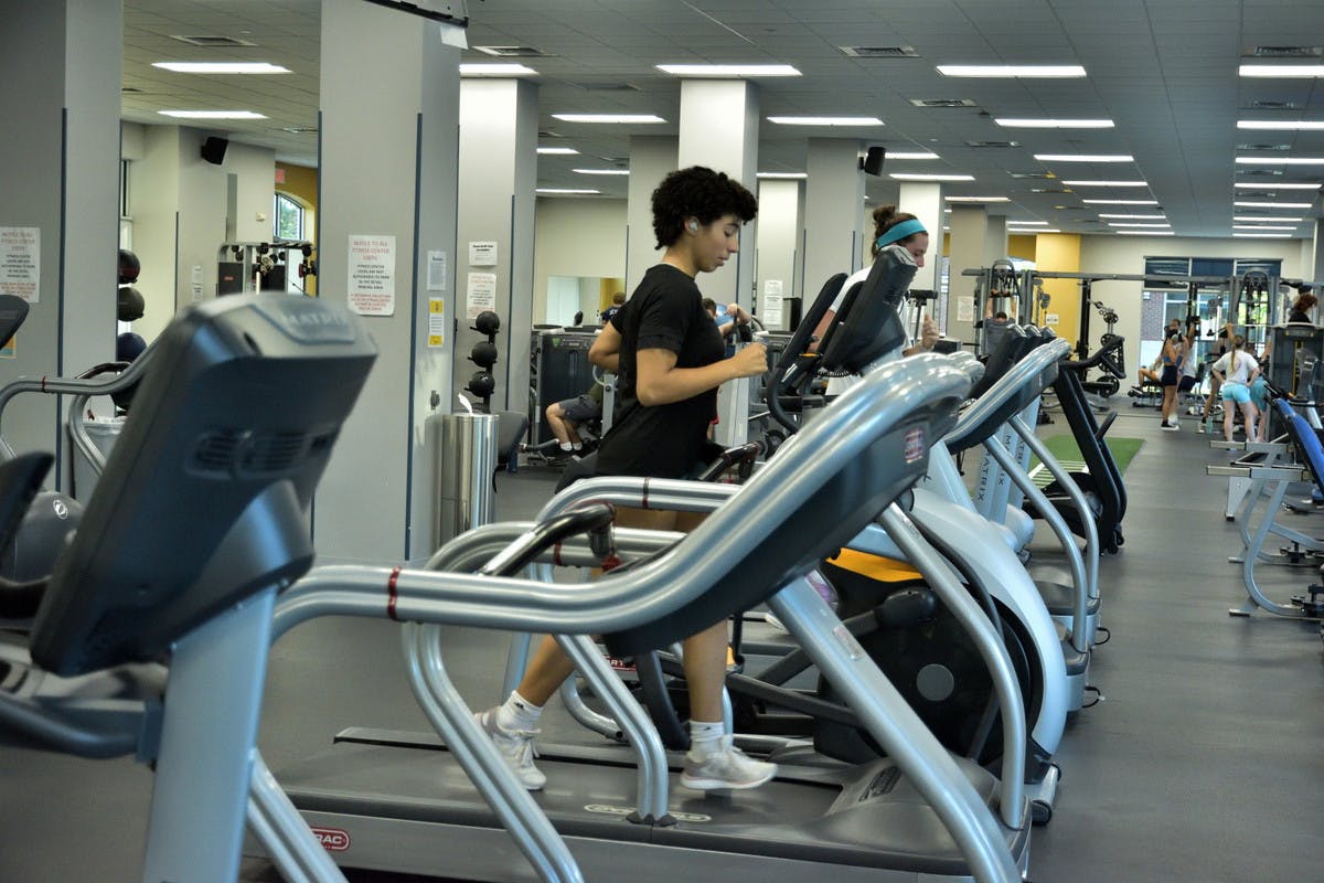 The atmosphere of the Fitness Center at Campus Town is very representative of gyms outside of the campus, as there are athletes, bodybuilders and people who want to lose weight (Photo by Shane Gillespie / Photo Editor).