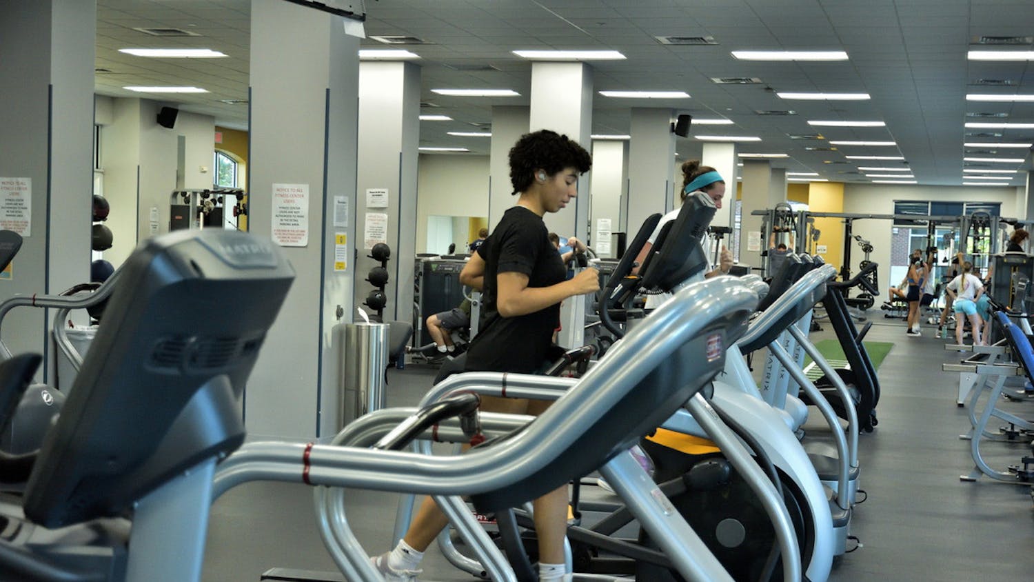 The atmosphere of the Fitness Center at Campus Town is very representative of gyms outside of the campus, as there are athletes, bodybuilders and people who want to lose weight (Photo by Shane Gillespie / Photo Editor).
