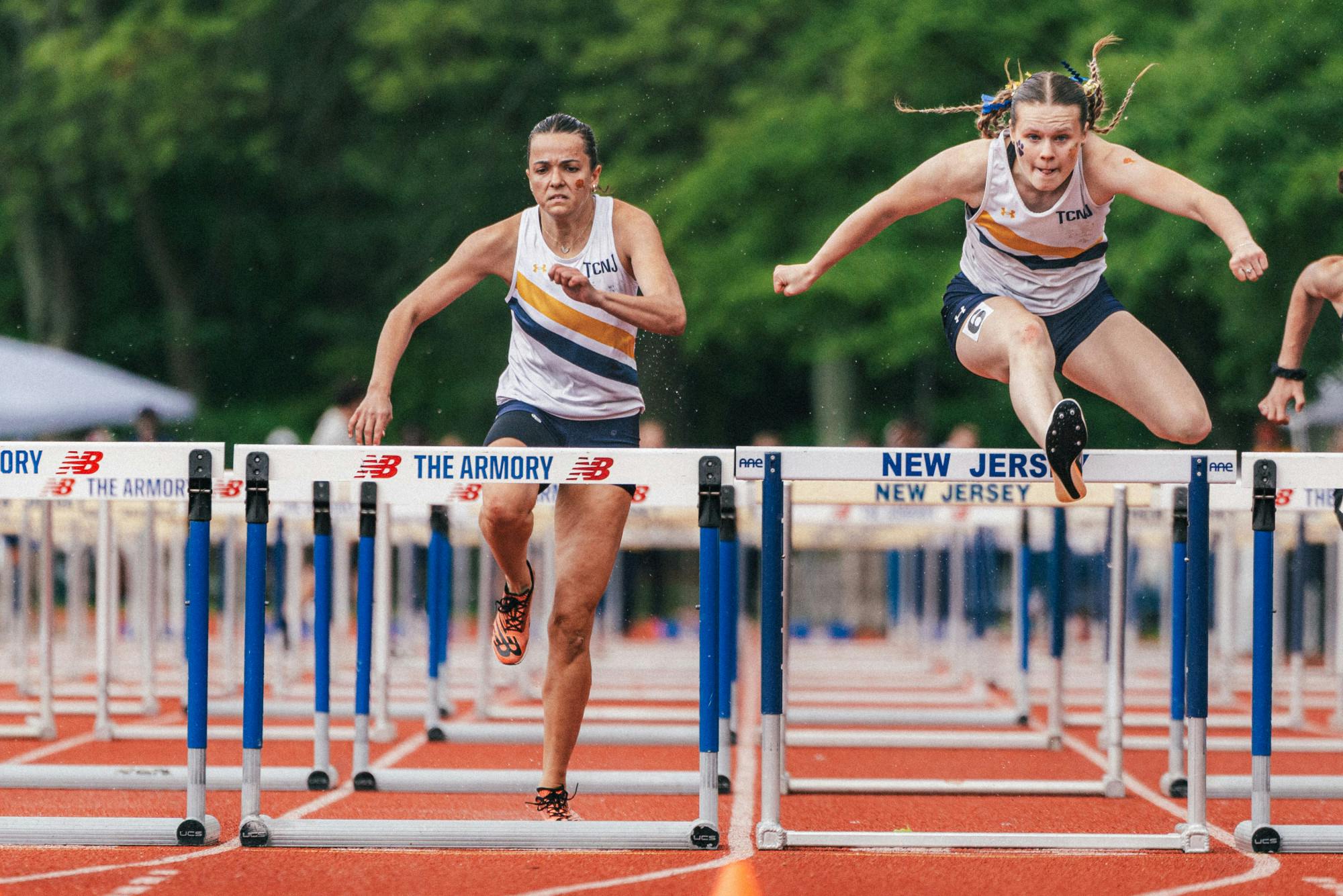 Sophomore Mackenzie Burke and Senior Eliza Bruncaj finished third and fourth respectively in the 400-meter hurdles. (Photo courtesy of Arion Owes)