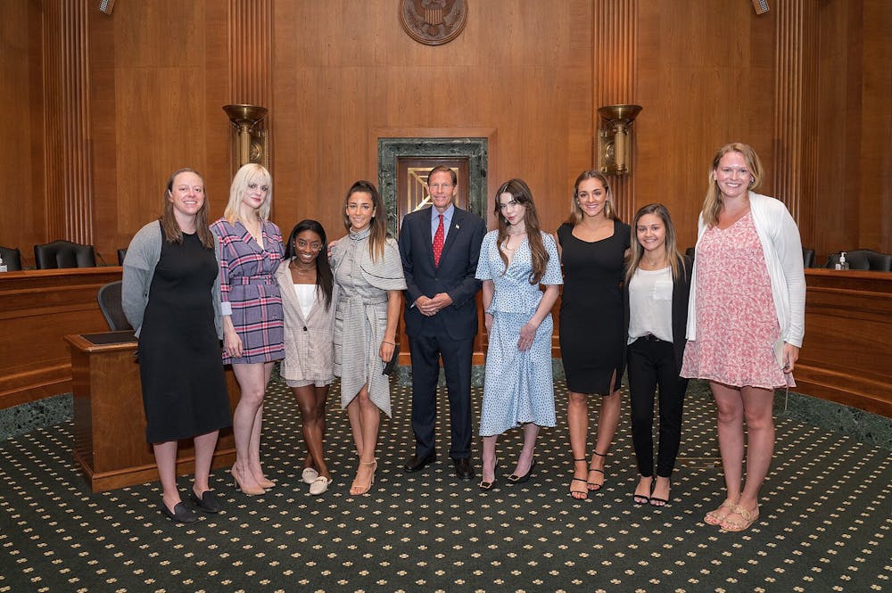 <p><em>USA Gymnastics stars Simone Biles, Aly Raisman, McKayla Maroney and Maggie Nichols testified before Congress during a 2021 Senate Judiciary Committee Hearing about the FBI’s failure to put a stop to Nassar’s abuse (Photo courtesy of </em><a href="https://commons.wikimedia.org/wiki/File:Richard_Blumenthal_with_USA_Gymnastics_sex_abuse_survivors.jpg" target=""><em>WikiMedia Commons</em></a><em> / by U.S. Sen. Richard Blumenthal, September 15, 2021).</em></p>