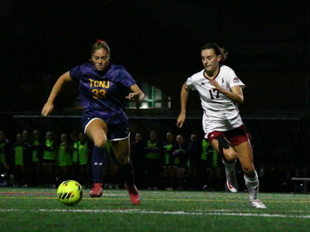 The College’s Ava Vissagio carries the ball through midfield against Stevens forward Alina Friz.