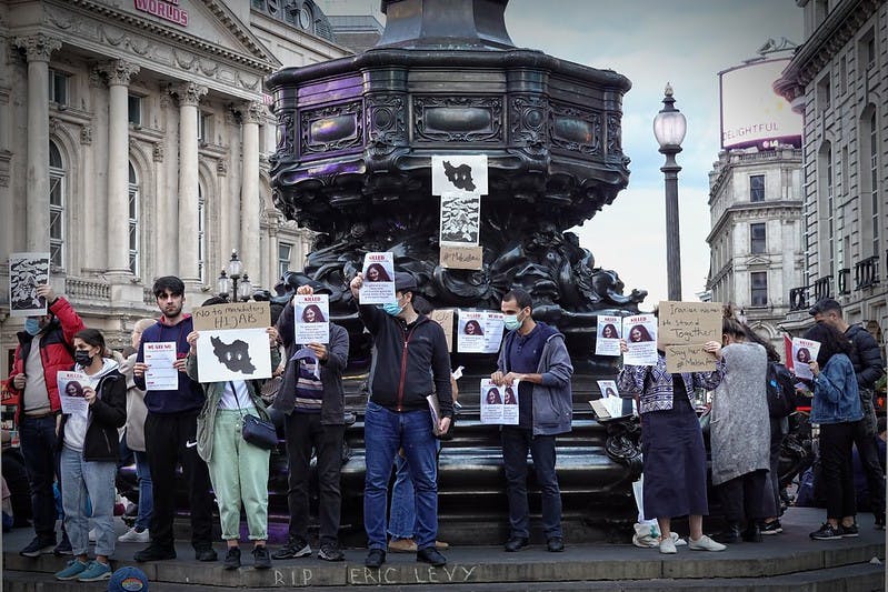 (Photo courtesy of Flickr/ “Mahsa Amini Protest 1” by Garry Knight)