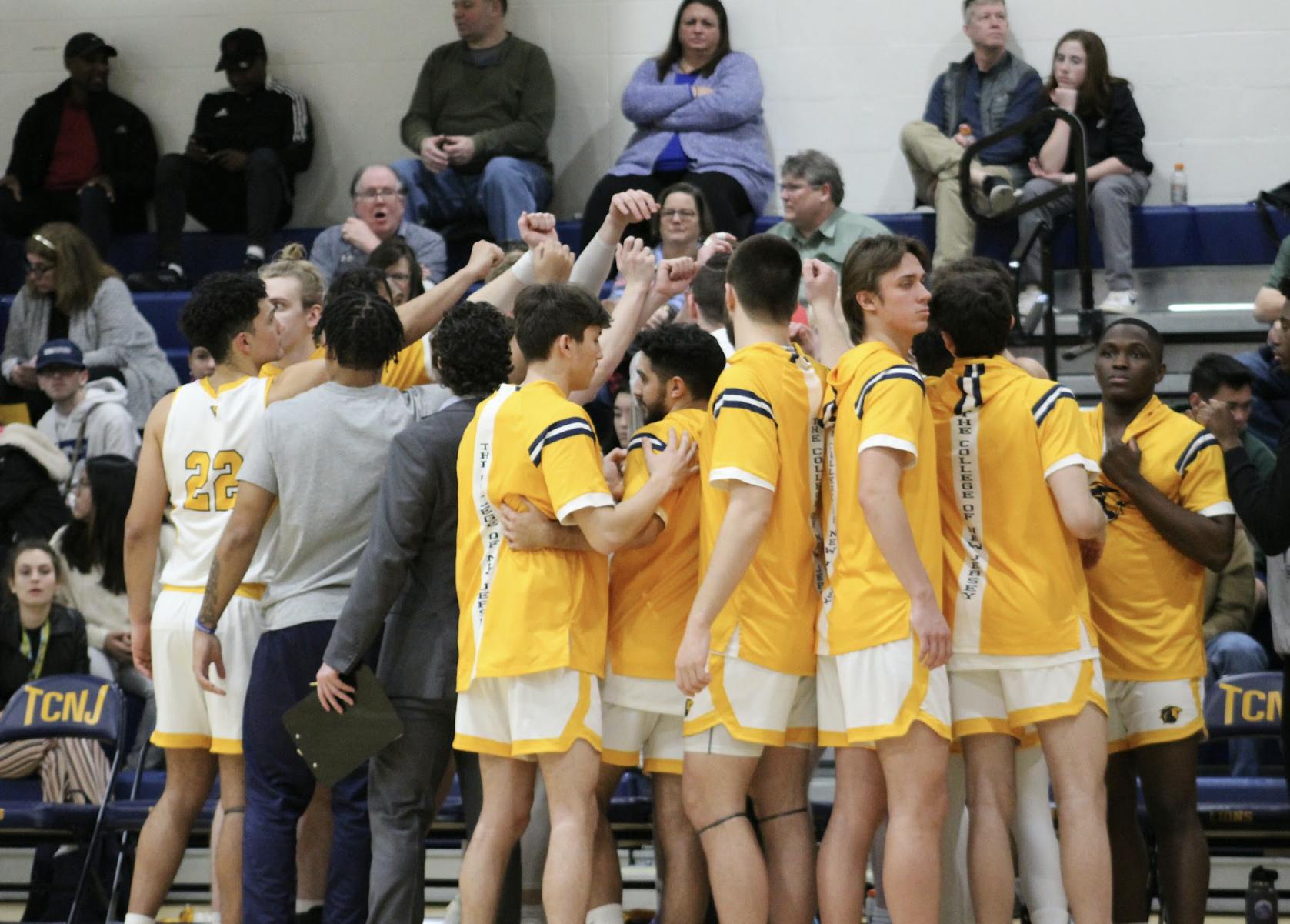 The College breaking their huddle (Photo courtesy of Elizabeth Gladstone / Multimedia Coordinator).