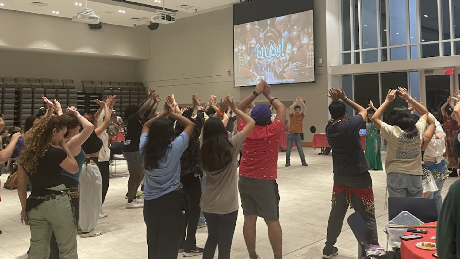 Students participating in interactive belly dance performance (Photo courtesy of Parisa Burton).