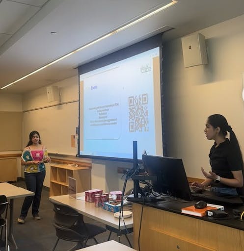 The College’s Girls Who Code co-presidents Lakshita Kapoor (left) and Krittika Verma (right) discussing the organization to interested members last semester. (Photo courtesy of Lakshita Kapoor and Krittika Verma)