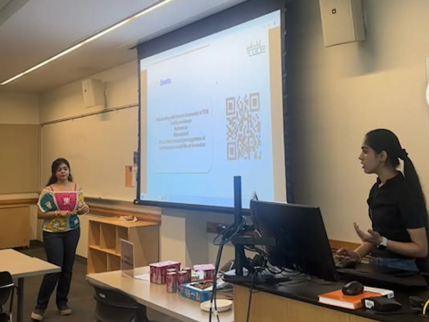 The College’s Girls Who Code co-presidents Lakshita Kapoor (left) and Krittika Verma (right) discussing the organization to interested members last semester. (Photo courtesy of Lakshita Kapoor and Krittika Verma)
