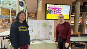 Brigette Wixted (Left) and Maria Hourihan (Right), a member of the Environmental Club at the Brower Student Center, showcasing their club’s initiatives. (Photo courtesy of Brigette Wixted)