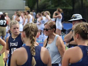 Coach Sharon Pfluger talking with her team (Photo courtesy of Elizabeth Gladstone / Multimedia Coordinator).