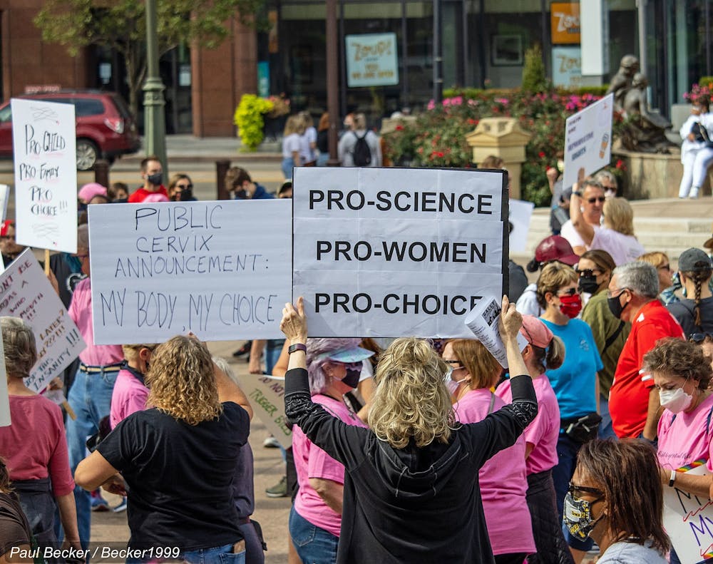 <p><em>In Ohio, voters approved a constitutional amendment on Nov. 7, with 57% of votes in favor of guaranteeing its citizens access to abortion and other forms of reproductive rights (Photo courtesy of Wikimedia Commons/“</em><a href="https://commons.wikimedia.org/wiki/File:Rally_for_Abortion_Justice_-_March_for_Women_2021-_Columbus_(10-2-21)_IMG_6127_(51547877553).jpg" target=""><em>Rally for Abortion Justice - March for Women 2021- Columbus (10-2-21)</em></a><em>” by Becker1999.  CC-BY-2.0. October 3, 2021). </em></p>