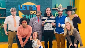 Cast members pose on set for a picture. (Photo courtesy of IMDb)