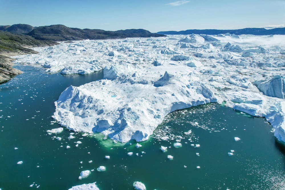 <p><em>President Trump’s Greenland takeover plan has sparked disapproval from its citizens. (Photo courtesy of </em><a href="https://commons.wikimedia.org/wiki/File:024_Aerial_view_of_Jakobshavn_Glacier_at_Disko_Bay_(Greenland)_Photo_by_Giles_Laurent.jpg" target="_blank"><em>Wikimedia Commons</em></a><em> / Giles Laurent, July 28, 2023)</em></p>