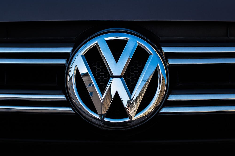 <p><em>Volkswagen announced their plans to close three of their factories in Germany (Photo courtesy of Wikimedia Commons / “</em><a href="https://commons.wikimedia.org/wiki/File:VOLKSWAGEN_badge_on_a_car.jpg" target=""><em>VOLKSWAGEN badge on a car</em></a><em>” by Ivan Radic. February 27, 2019). </em></p>