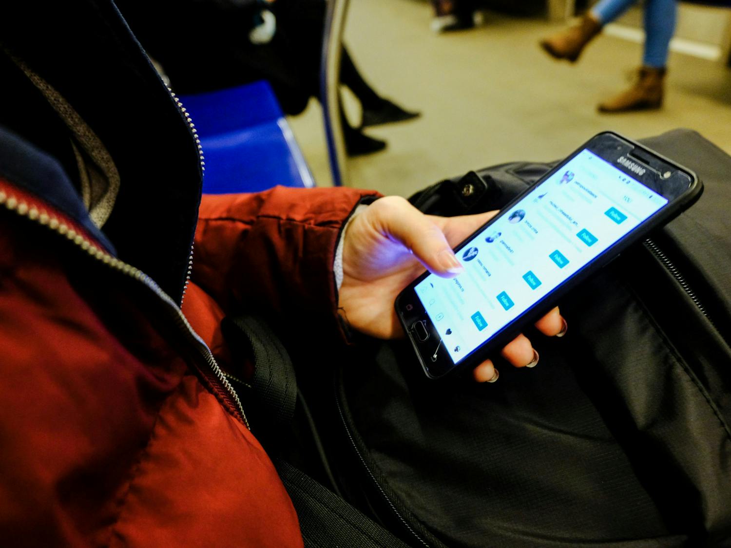 Social Media should have more user-controlled content moderation. (Photo courtesy of Flickr,“Girl Checking her Instagram” by Themeisle, Feb 2, 2019)