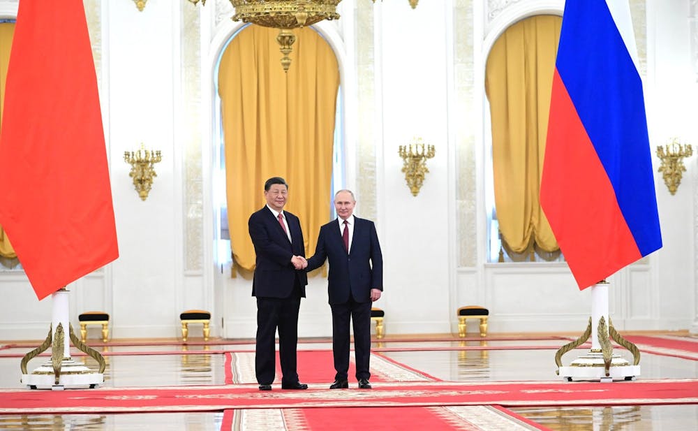 <p><em>Rus​​sian President Vladimir Putin visited China on Oct. 17 in a show of support for the nation’s leader Xi Jinping’s efforts to expand its economy and influence overseas (Photo courtesy of Wikimedia Commons/“</em><a href="https://commons.wikimedia.org/wiki/File:Putin-Xi_meeting_(2023).jpg" target=""><em>Putin-Xi meeting (2023)</em></a><em>” by Presidential Executive Office of Russia. March 21, 2022). </em></p>