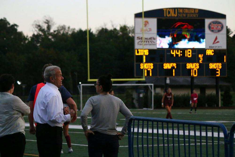President Michael Bernstein watches as women's soccer takes down Arcadia