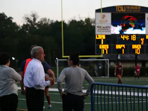 President Michael Bernstein watches as women's soccer takes down Arcadia