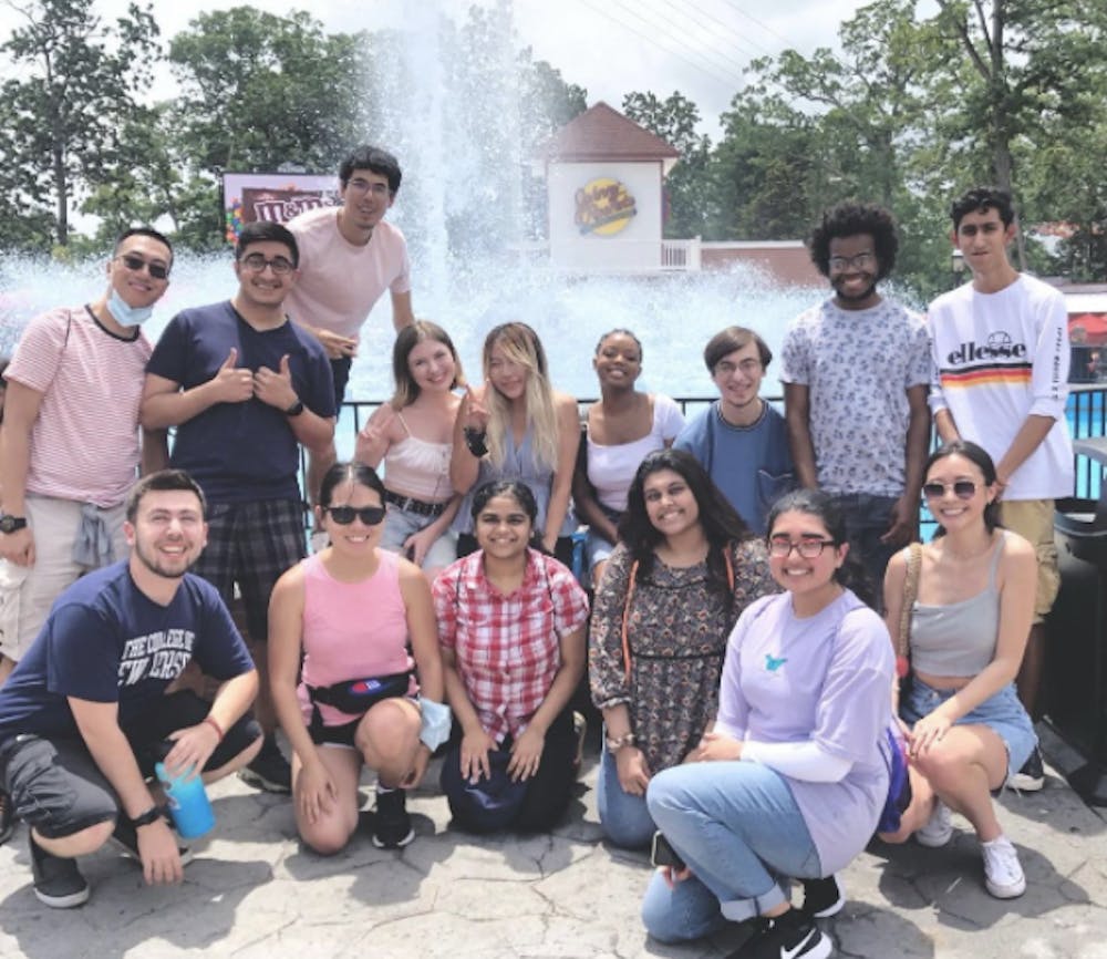 <p><em>May, in the middle holding the peace sign, along with Kappa Theta Phi members at Six Flags Great Adventure (Instagram @kdptcnj).  </em></p>