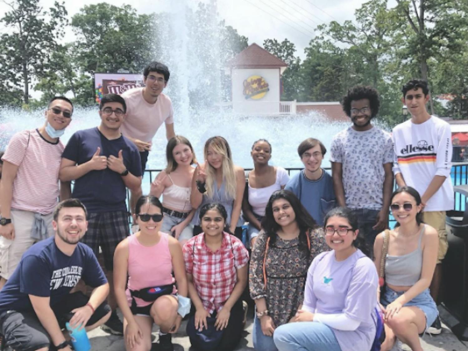 May, in the middle holding the peace sign, along with Kappa Theta Phi members at Six Flags Great Adventure (Instagram @kdptcnj).  