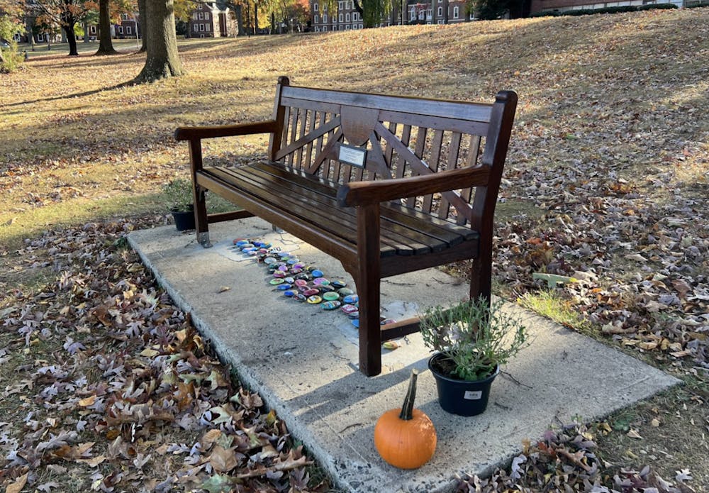 <p><em>The bench dedicated to the late Michael Zuccarello is located near his fishing spot at Lake Sylva (Photo by Victoria Gladstone).</em></p>