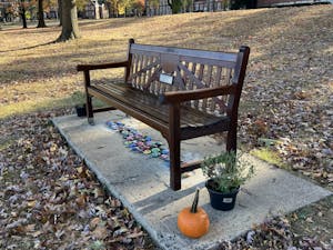 The bench dedicated to the late Michael Zuccarello is located near his fishing spot at Lake Sylva (Photo by Victoria Gladstone).