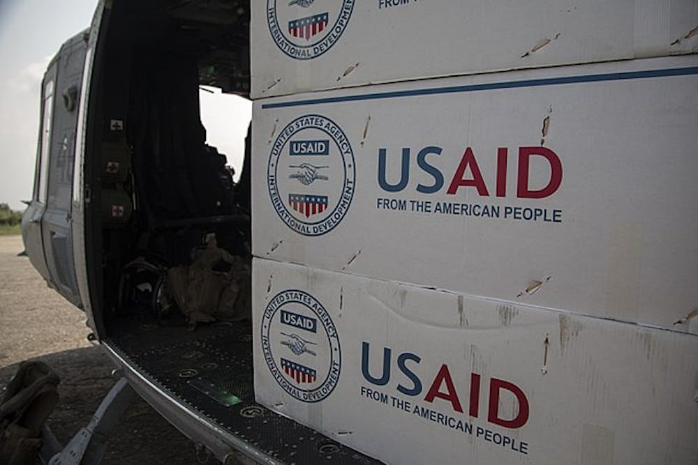 <p><em>USAID faces calls for defunding and debates continue over its critical role. (Photo courtesy of </em><a href="https://commons.wikimedia.org/wiki/File:US_aid_loaded.jpg" target=""><em>Wikimedia Commons</em></a><em> / U.S. Marine Corps, May 18, 2015)</em></p>