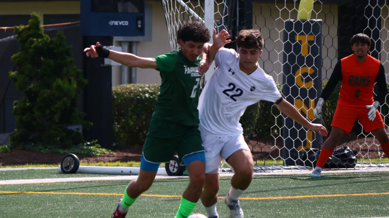 Sophomore Aidan Ayar battles for the ball against Farmingdale State