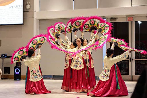 The Korean School performing their traditional fan dance. (Photo courtesy of Zach Diaz)