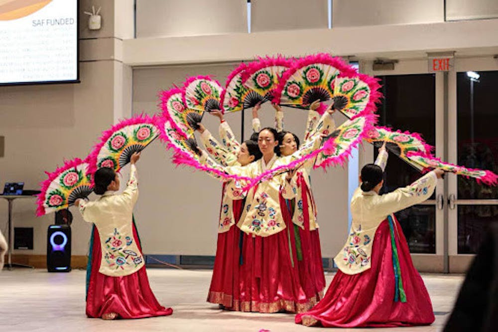 <p><em>The Korean School performing their traditional fan dance. (Photo courtesy of Zach Diaz)</em></p><p><br/></p>