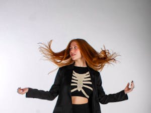 Outfit Pictured: Blazer and Skirt, TJ Maxx. Black Crop Tank, Cotton on. Skeleton Sweater, Etsy. Socks, Walmart. Shoes, Vintage Sam and Libby (Photo courtesy of Jessie Bodnar)