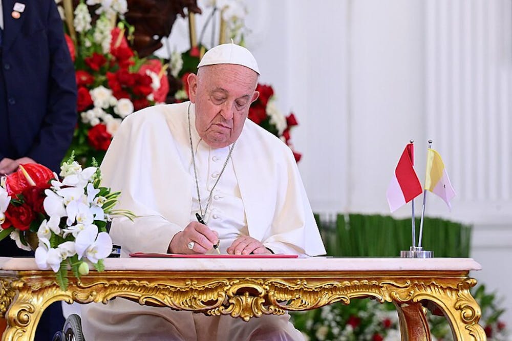 <p><em>Pope Francis was hospitalized with double pneumonia but his condition is not life-threatening. (Photo courtesy of </em><a href="https://commons.wikimedia.org/wiki/File:Pope_Francis_signing_a_document_at_Merdeka_Palace.jpg" target=""><em>Wikimedia Commons</em></a><em> / Government of Indonesia, Sep. 4, 2024)</em></p>