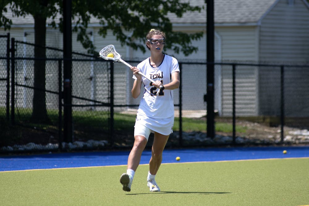 <p><em>Lacrosse battles on senior day. (Photo courtesy of Jimmy Alagna)</em></p>
