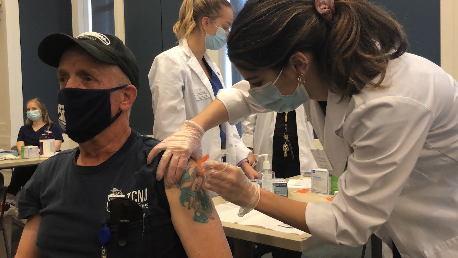 A faculty member gets his Moderna booster shot at the clinic (Delaney Smith / The Signal).