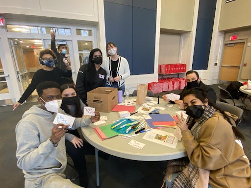 Students and staff making letters for literacy kits (Karla Fonseca / Staff Writer).