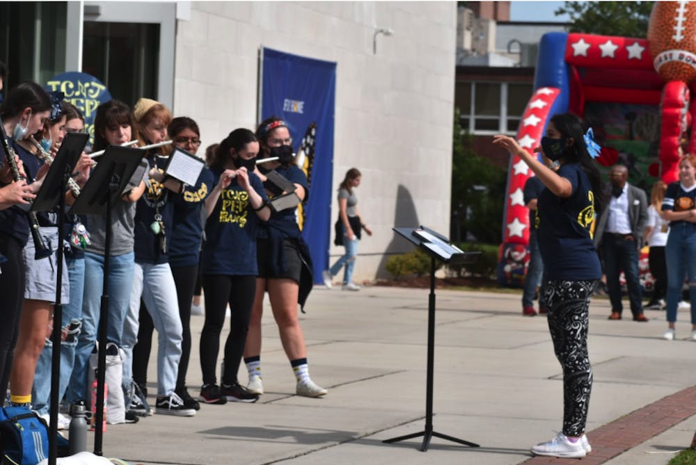 <p><em>Students in the Pep Band perform during the Homecoming Fest outside of the Brower Student Center on Oct. 2 (Liz Osekavage / Photo Editor).</em></p>