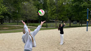 Kendra Baker plays volleyball with friends on campus at the College in May. (Photo by Isabella McHugh / Nation & World Editor)