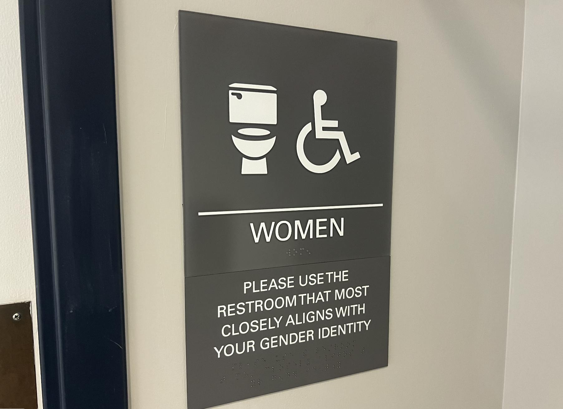 A group organized by College Planning collaborated to bring more inclusive bathroom signs to some academic buildings (Photo by Elizabeth Gladstone / Multimedia Coordinator).