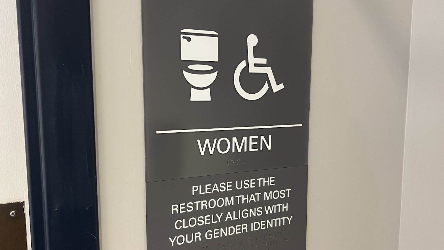 A group organized by College Planning collaborated to bring more inclusive bathroom signs to some academic buildings (Photo by Elizabeth Gladstone / Multimedia Coordinator).
