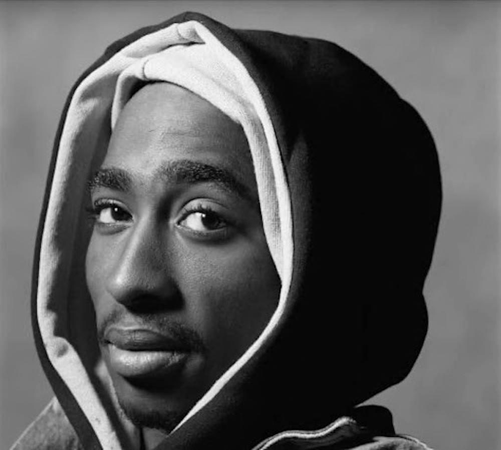 <p><em>Tupac Shakur, a famous rapper who was tragically killed in a drive-by. (Photo courtesy of </em><a href="https://www.imdb.com/name/nm0000637/mediaviewer/rm2881198336/?ref_=nmmi_mi_13_1" target=""><em>IMDb</em></a><em>)</em></p>