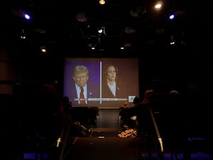 Attendees of the watch party got to experience the presidential debate on the big screen in Kendall Hall’s black box theater (Photo by Matthew Kaufman).
