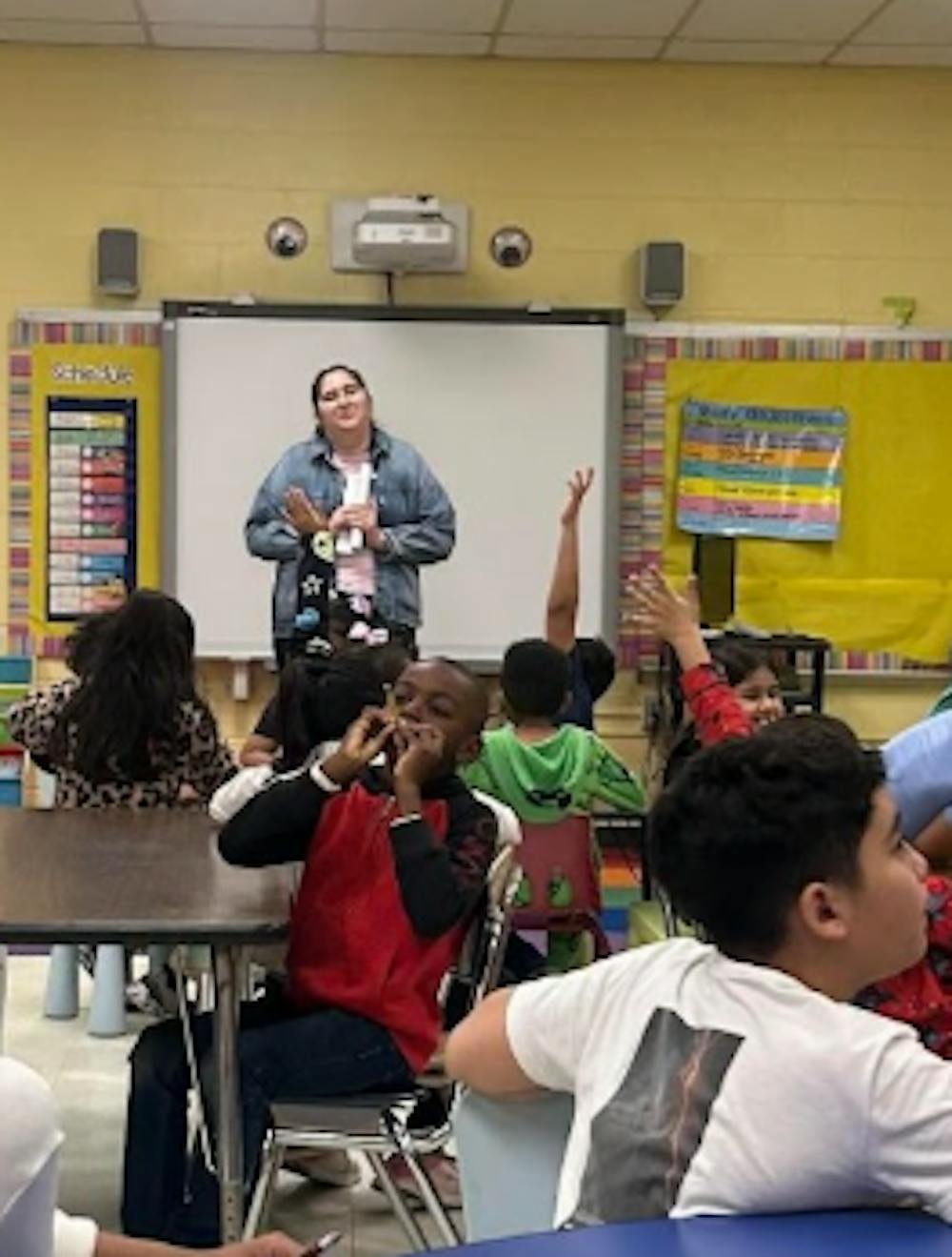 <p><em>Isabella Herrada, a junior and education major at TCNJ, student teaching to her class. (Photo courtesy of Isabelle Herrada)</em></p><p></p>