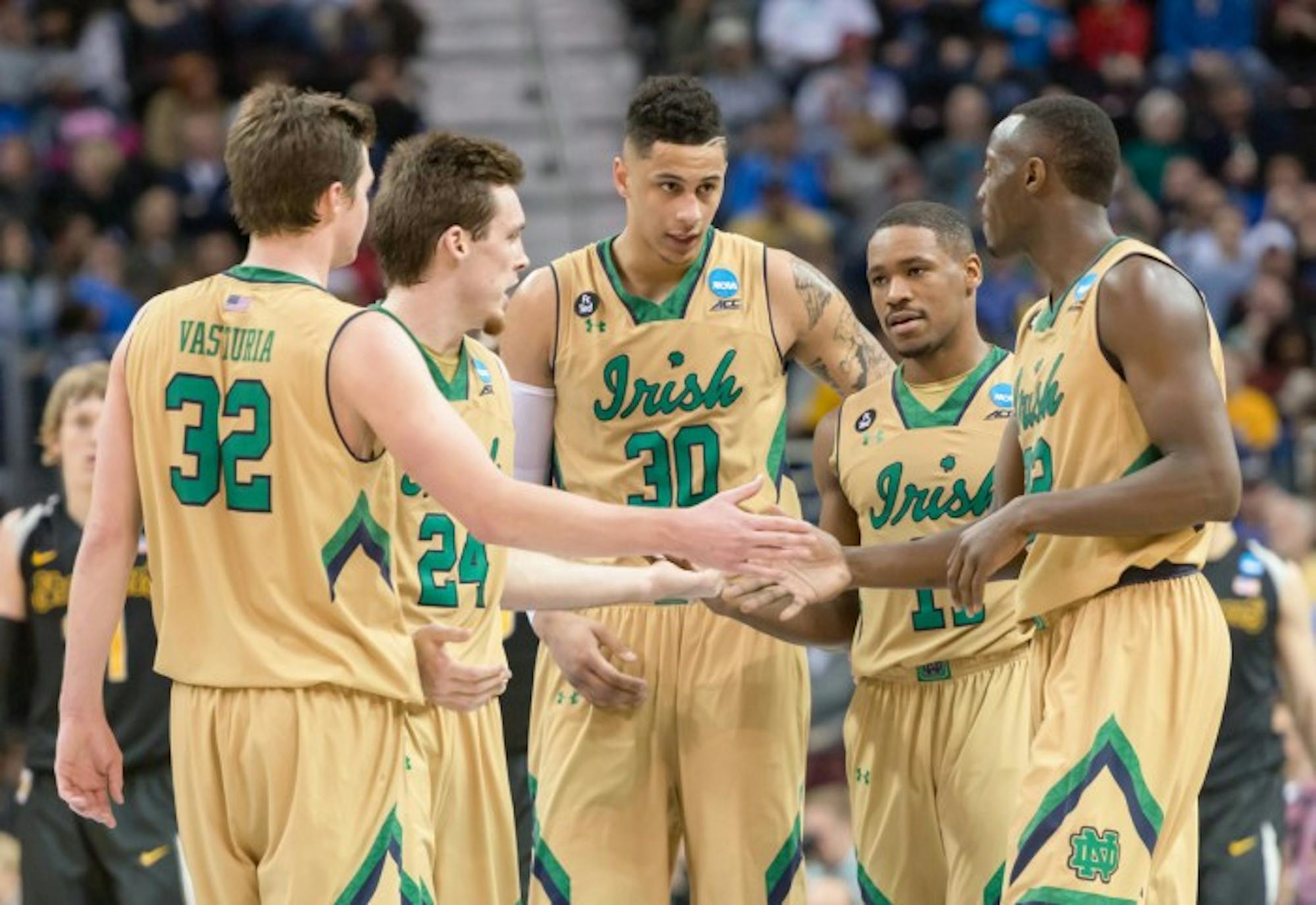 The 2014-2015 men’s basketball team hudles up during an 81-70 victory over Wichita State on March 26 in Cleveland, OH. The Irish advanced to the Elite Eight with the win.