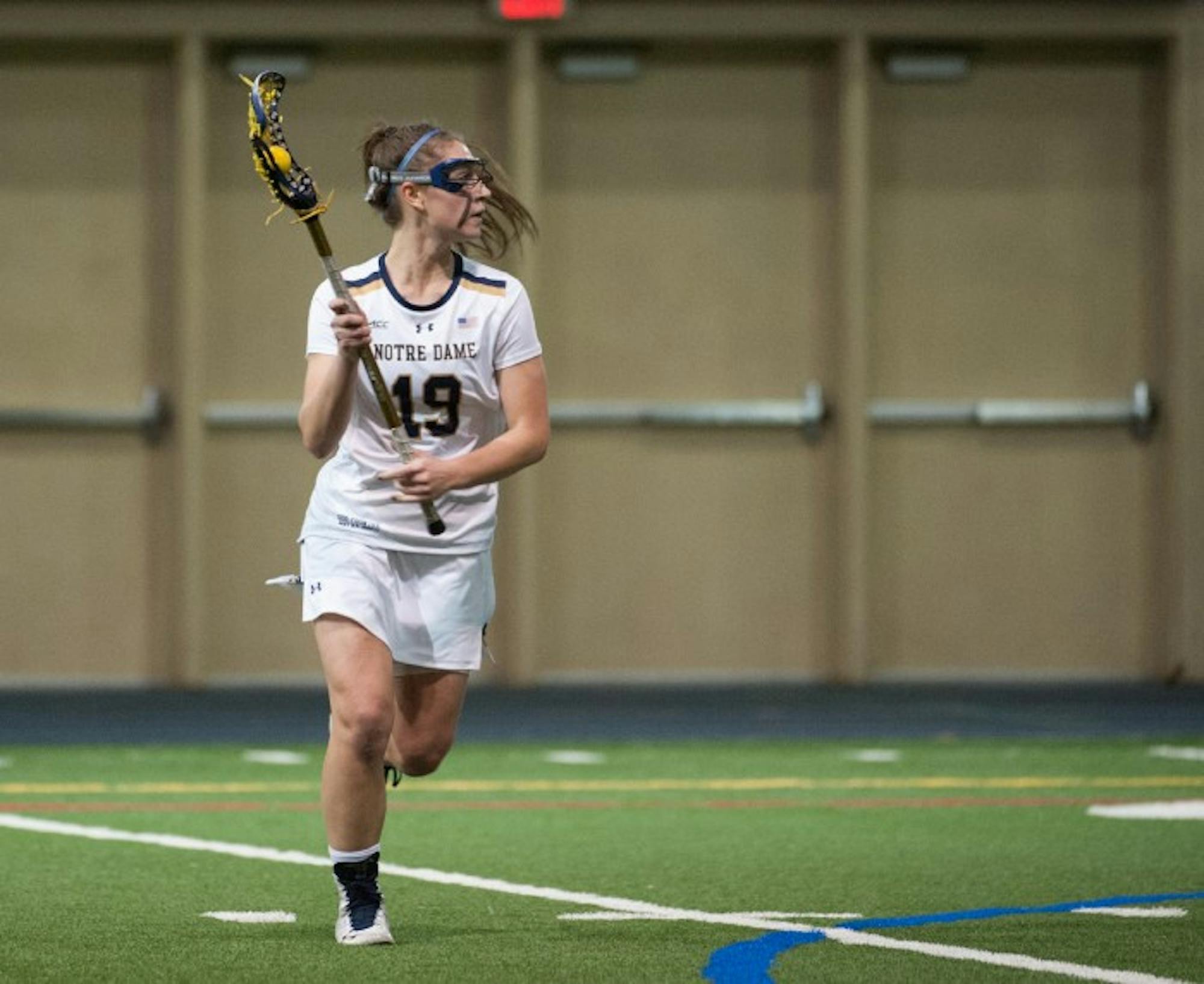 Sophomore midfielder Makenna Pearsall looks to pass during Notre Dame’s 24-9 win over Detroit on Feb. 11 at Loftus Sports Center.