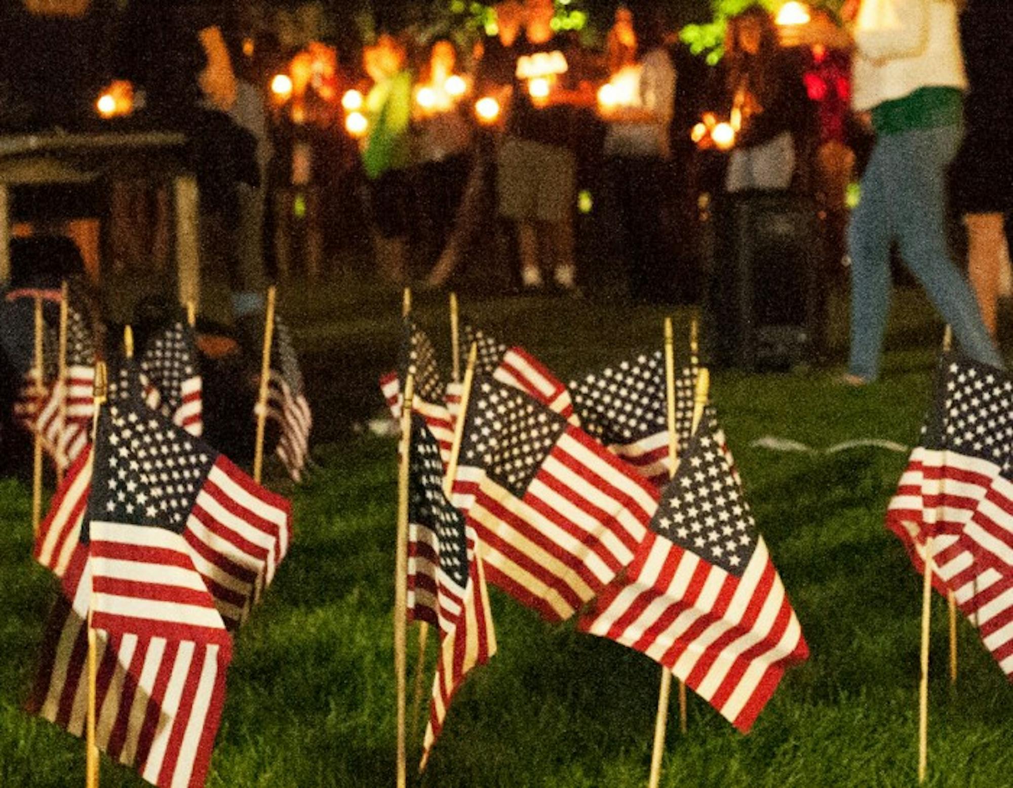 American flags adorn South Quad as student, faculty and community members gather for a candle-lit prayer service and Grotto procession led by Fr. Malloy, Notre Dame's president during 9/11.