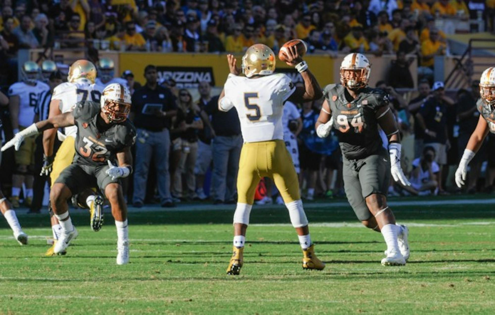 Senior quarterback Everett Golson drops back to pass during Notre Dame’s 55-31 loss Saturday at Arizona State. Golson has turned the ball over 17 times in the last six games, including five times Saturday.
