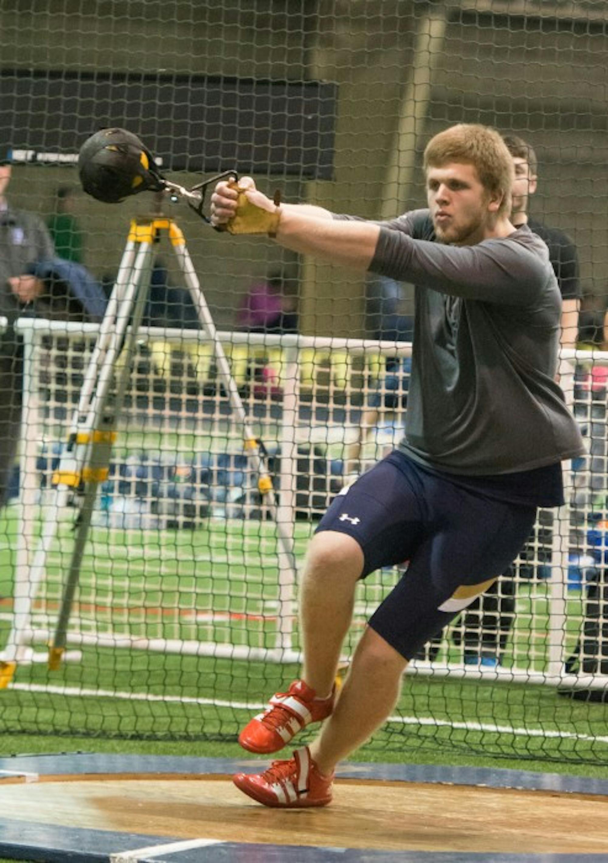 Junior weight thrower Anthony Shivers begins his throwing motion during the Blue and Gold Invitational on Dec. 5, 2014.