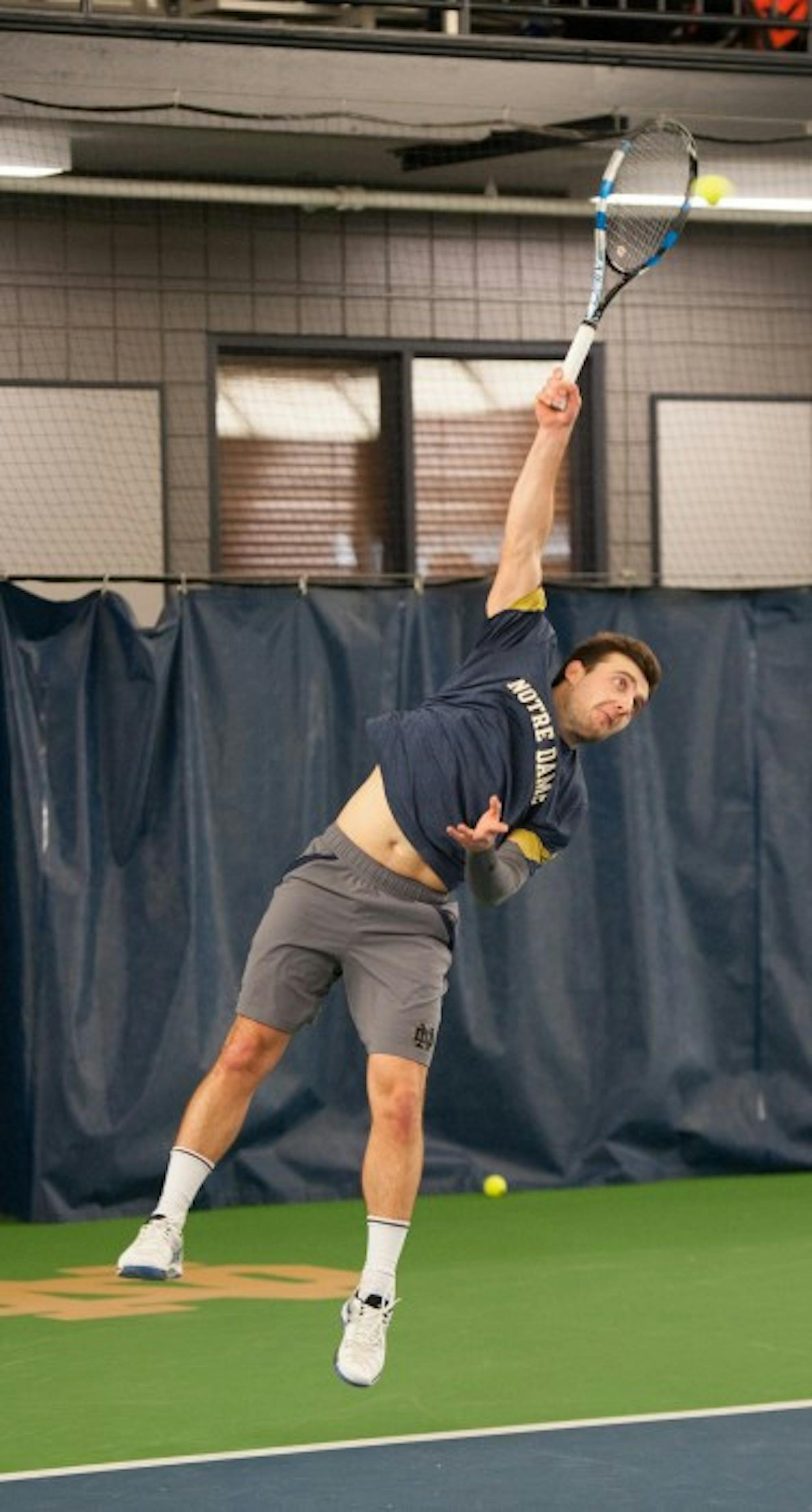Irish senior Eddy Covalschi serves the ball during Notre Dame's 7-0 win over Boston College on Feb. 11 at Eck Tennis Pavilion.