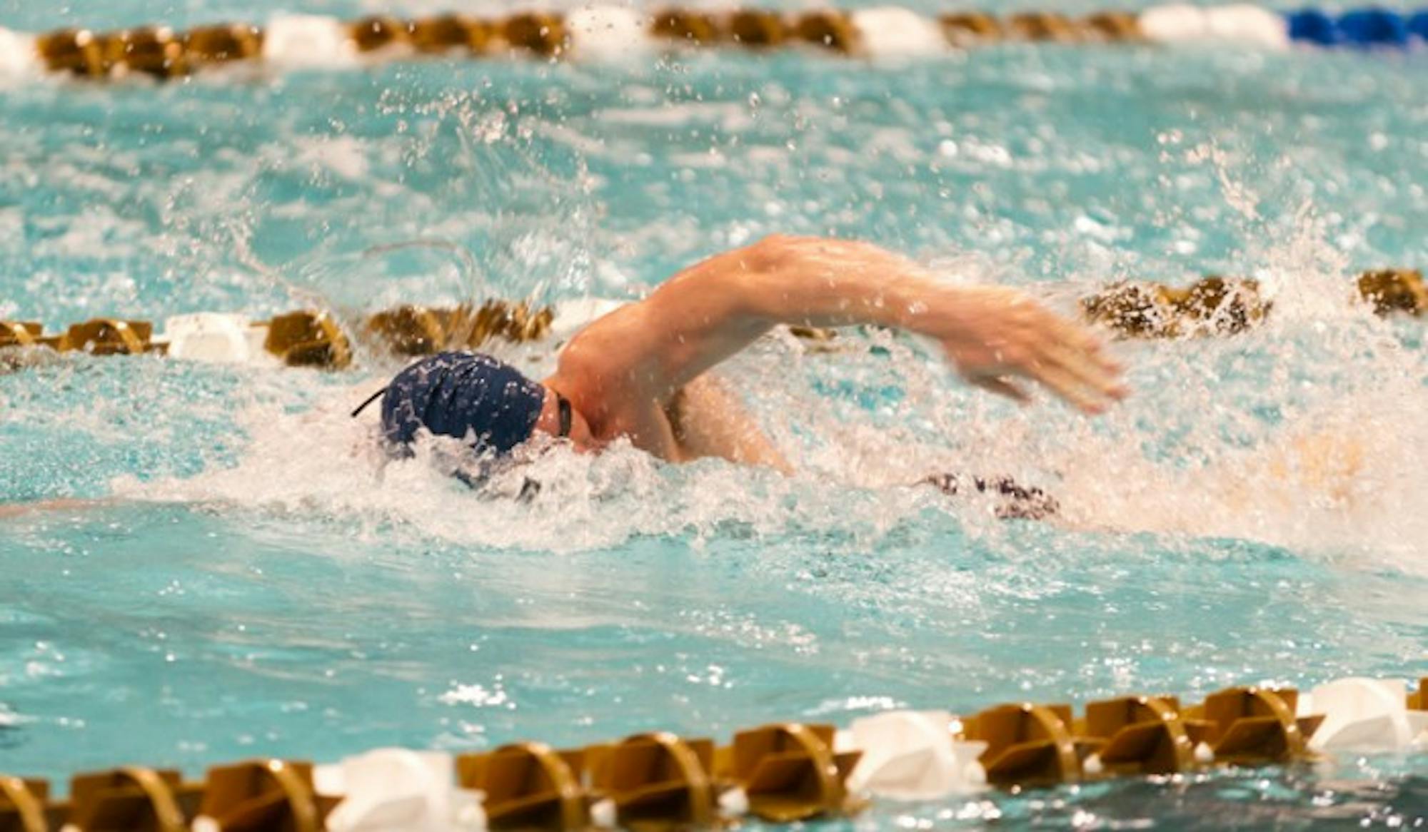 Irish senior freestyler Frank Dyer swims his leg of the 400-yard medley relay during last season’s Shamrock Invitational held at Rolf Aquatic Center on Jan. 25, 2013. Dyer’s relay team finished second.