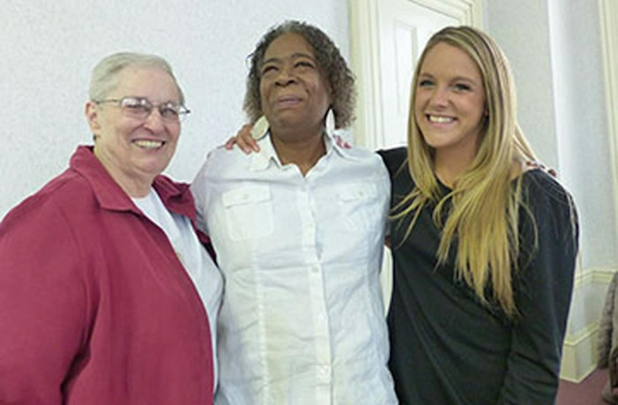 Sister Linda Bellemore (left) introduced South Bend resident Sheila Muhammad (center) and SMC senior Morgan Carroll. Carroll recorded and transcribed Muhammad’s life story for Muhammad’s children.