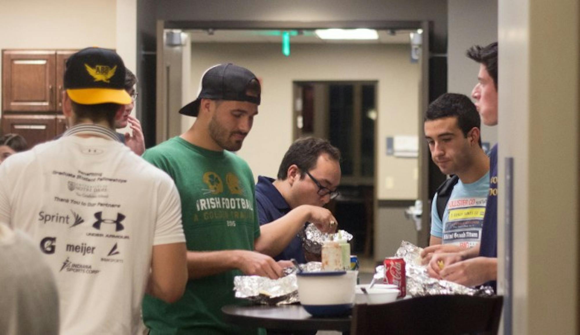 Students enjoy tacos in Dunne Hall on Thursday for the grand opening of Dungeon Tacos.